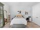Serene bedroom boasts a comfortable bed, stylish decor, and a tranquil ambiance at 6317 Rivo Lakes Blvd, Sarasota, FL 34241