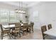 Bright dining area featuring shiplap walls and abundant natural light from multiple windows at 6317 Rivo Lakes Blvd, Sarasota, FL 34241