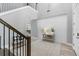 Bright foyer features wood-look flooring, a staircase, and stylish shiplap accent wall at 6317 Rivo Lakes Blvd, Sarasota, FL 34241