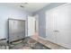 Hallway with coat closet, tile floors and view into other rooms at 6317 Rivo Lakes Blvd, Sarasota, FL 34241