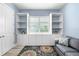 Stylish living room with custom built-in shelves, storage, and a comfortable couch, creating an inviting space at 6317 Rivo Lakes Blvd, Sarasota, FL 34241