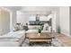 Spacious living room featuring an open floor plan with views of kitchen at 6317 Rivo Lakes Blvd, Sarasota, FL 34241