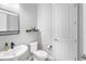 Contemporary powder room featuring modern fixtures, clean lines, and a minimalist design for a sleek, functional space at 6317 Rivo Lakes Blvd, Sarasota, FL 34241