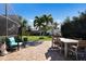 Outdoor patio with pavers, surrounded by tropical landscaping, and offering room to dine and relax at 7301 12Th W Ave, Bradenton, FL 34209