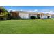 Well-maintained house featuring a lush green lawn and mature landscaping in the front yard at 7301 12Th W Ave, Bradenton, FL 34209