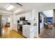 Modern kitchen with white cabinetry, stainless steel appliances, and seamless access to the adjacent living area at 7301 12Th W Ave, Bradenton, FL 34209