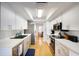 Bright kitchen features stainless steel appliances, white cabinets and plenty of counter space at 7301 12Th W Ave, Bradenton, FL 34209