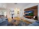Well-lit living room with hardwood floors, modern entertainment center and an open, welcoming atmosphere at 7301 12Th W Ave, Bradenton, FL 34209