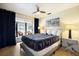 Light-filled bedroom with drapes, bedside lamps, and access to the patio at 7301 12Th W Ave, Bradenton, FL 34209