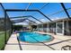 Sparkling pool featuring a screened enclosure and brick coping at 7301 12Th W Ave, Bradenton, FL 34209