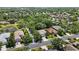 Aerial view of the neighborhood with mature trees, landscaping and water features at 7439 Sea Island Ln, University Park, FL 34201