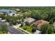 Aerial view of the homes with mature landscaping and the surrounding lush, green trees at 7439 Sea Island Ln, University Park, FL 34201