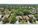 Beautiful aerial view of the neighborhood with mature trees and well-maintained landscaping at 7439 Sea Island Ln, University Park, FL 34201
