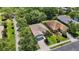 Overhead view showcasing landscaping and tree coverage with a nicely manicured lawn at 7439 Sea Island Ln, University Park, FL 34201