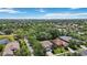 This is an aerial view of the houses in the community lined with green trees at 7439 Sea Island Ln, University Park, FL 34201