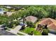 Birds eye view of the single-Gathering home with a manicured lawn, mature landscaping, and neighborhood view at 7439 Sea Island Ln, University Park, FL 34201
