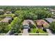 An aerial view of a well-maintained single Gathering home with mature trees and landscaping at 7439 Sea Island Ln, University Park, FL 34201