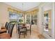 Inviting breakfast nook with lots of windows, and light tile floors at 7439 Sea Island Ln, University Park, FL 34201