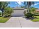 Charming single-story home with a well-maintained lawn, mature landscaping, and a two-car garage at 7439 Sea Island Ln, University Park, FL 34201