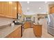 Well-equipped kitchen with granite countertops, stainless steel appliances and tile floors at 7439 Sea Island Ln, University Park, FL 34201