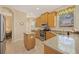 Well-equipped kitchen with stainless steel appliances, granite countertops, and light wood cabinetry at 7439 Sea Island Ln, University Park, FL 34201