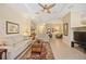Spacious living room featuring tile floors, neutral walls, ceiling fan and comfortable seating at 7439 Sea Island Ln, University Park, FL 34201