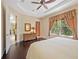 Bright main bedroom featuring hardwood floors, large window, and neutral paint colors at 7439 Sea Island Ln, University Park, FL 34201