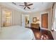 Spacious main bedroom features hardwood floors, tray ceiling, and access to an en-suite bathroom at 7439 Sea Island Ln, University Park, FL 34201