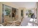 Covered patio featuring a dining area, and sliding glass doors to the home's interior at 7439 Sea Island Ln, University Park, FL 34201