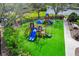 Aerial view of a vibrant playground with modern play equipment and manicured landscaping at 7439 Sea Island Ln, University Park, FL 34201