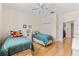 Comfortable bedroom with two twin beds and a bright, cheerful atmosphere at 7470 Botanica Pkwy # 201B22, Sarasota, FL 34238