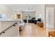 Bright, neutral living room with hardwood floors and ample space for entertaining at 7470 Botanica Pkwy # 201B22, Sarasota, FL 34238