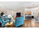 Bright and spacious living room featuring hardwood floors, recessed lighting, and stylish, comfortable seating at 7470 Botanica Pkwy # 201B22, Sarasota, FL 34238