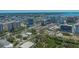 An aerial view of the Sarasota skyline and waterfront with the condo highlighted in the distance at 750 N Tamiami Trl # 304, Sarasota, FL 34236