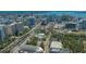 An aerial view of the Sarasota skyline and waterfront with the condo highlighted in the distance at 750 N Tamiami Trl # 304, Sarasota, FL 34236