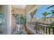 Balcony with seating and plants and views of the neighborhood at 750 N Tamiami Trl # 304, Sarasota, FL 34236