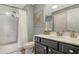 Updated bathroom featuring double shower heads, large vanity and modern finishes at 750 N Tamiami Trl # 304, Sarasota, FL 34236