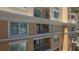 Exterior view of building featuring windows and balconies showcasing outdoor living spaces at 750 N Tamiami Trl # 304, Sarasota, FL 34236