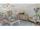 Open-concept living and dining area with elegant furnishings and a large decorative cabinet at 750 N Tamiami Trl # 304, Sarasota, FL 34236