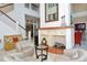 The condo features a luxurious lobby area with fireplace, marble floors, and comfortable seating at 750 N Tamiami Trl # 304, Sarasota, FL 34236