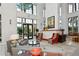 A stunning two-story lobby entrance with designer furniture and natural lighting at 750 N Tamiami Trl # 304, Sarasota, FL 34236