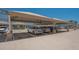 Covered parking garage featuring assigned parking spaces and carports offering protection from the elements at 750 N Tamiami Trl # 304, Sarasota, FL 34236