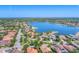 Expansive aerial view of a residential community surrounding a beautiful lake at 7643 Haddington Cv, Bradenton, FL 34202