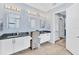 Spacious bathroom featuring granite counters, double sinks, and custom lighting at 7643 Haddington Cv, Bradenton, FL 34202