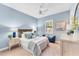 Stylishly furnished bedroom with blue accents, soft lighting, and serene ambiance at 7643 Haddington Cv, Bradenton, FL 34202