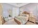 Calming bedroom with natural textures, complemented by shuttered windows and soft, stylish accents at 7643 Haddington Cv, Bradenton, FL 34202