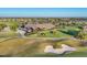 An aerial view of the expansive golf clubhouse and meticulously maintained golf course at 7643 Haddington Cv, Bradenton, FL 34202