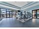 Community fitness center with modern equipment and large windows providing abundant natural light at 7643 Haddington Cv, Bradenton, FL 34202