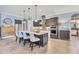 Modern kitchen featuring stainless steel appliances, a large center island with bar stools, and ample counter space at 7643 Haddington Cv, Bradenton, FL 34202