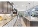 Gourmet kitchen featuring granite countertops, stainless steel appliances and a spacious center island at 7643 Haddington Cv, Bradenton, FL 34202